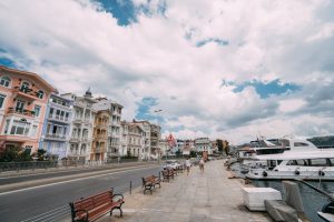 Charming Arnavutköy seafront with colorful houses and yachts in Istanbul.